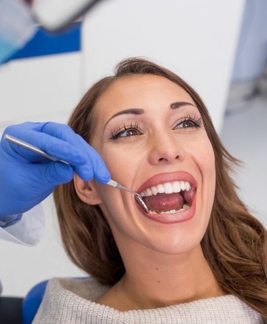 Woman receiving a dental checkup in Arlington Heights