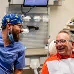 Dentist laughing with a dental patient