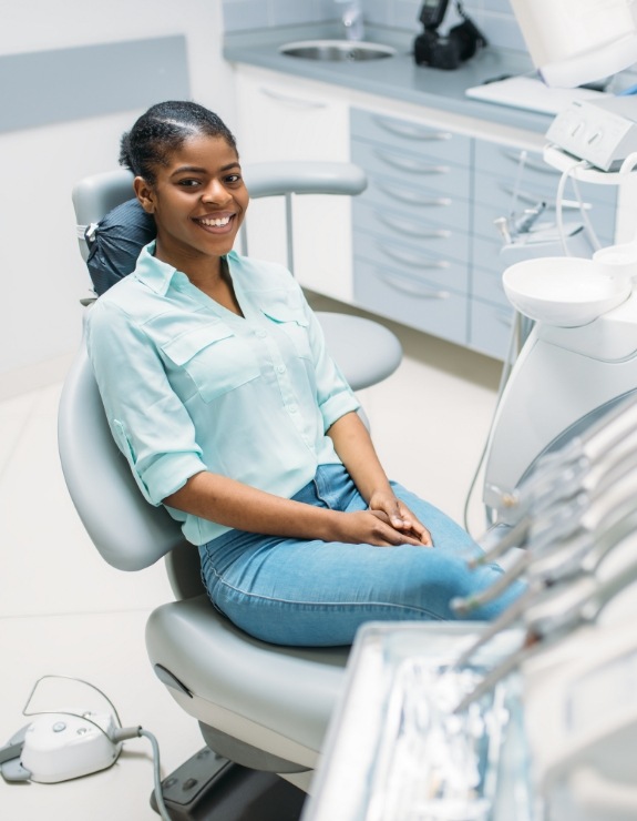 Woman sitting patiently in dental chair