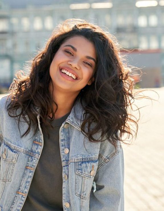 Lady smiles outdoors