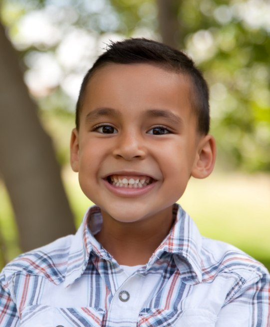 Young boy smiling after visiting childrens dentist in Arlington Heights