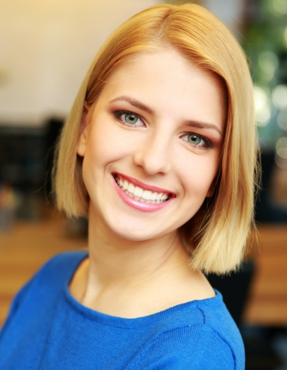 Woman with blonde bob smiling