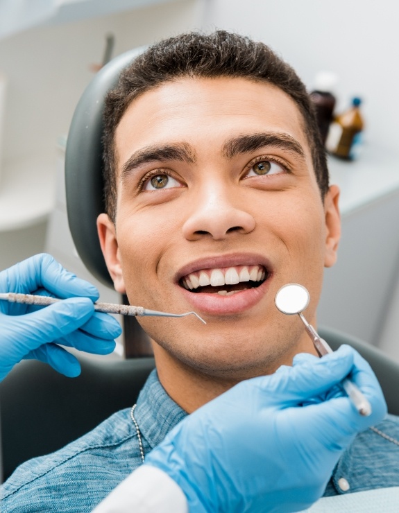 Man receiving a dental exam