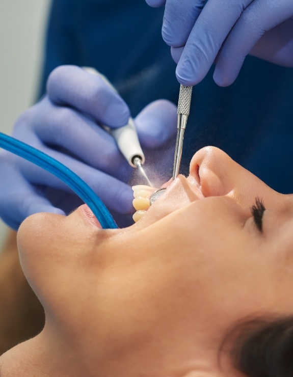 Woman receiving gum disease treatment