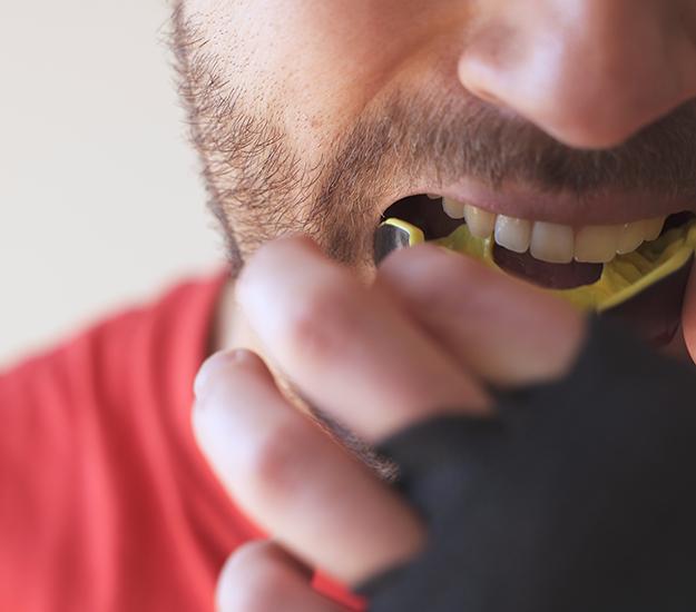 Patient in Arlington Heights wearing a mouthguard