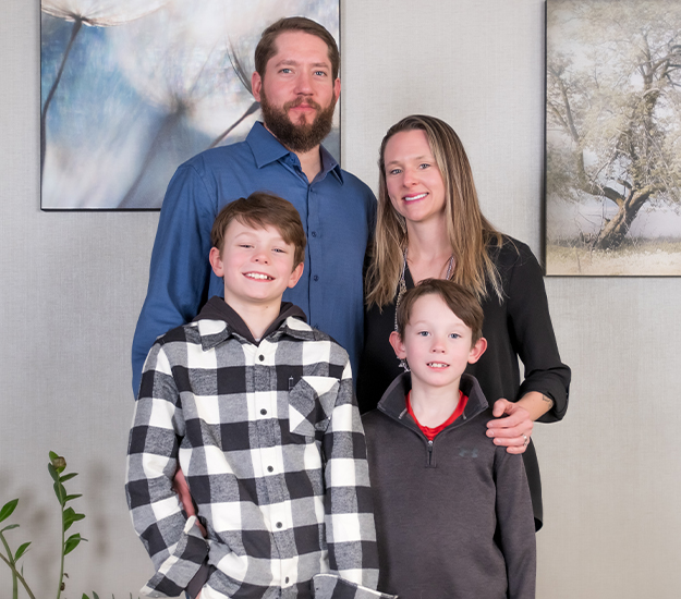 Doctor DeHart with his wife and two sons