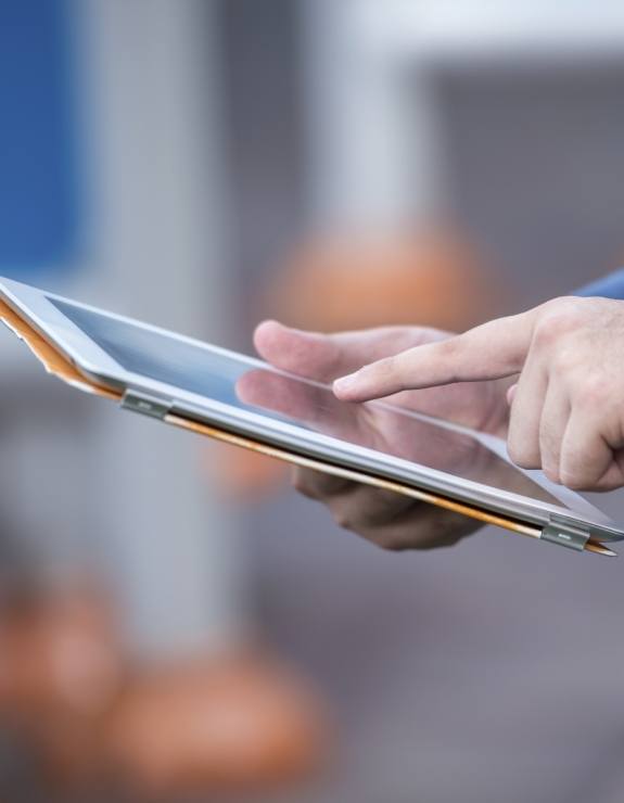 Person typing on a tablet