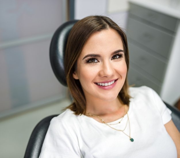 Smiling woman sitting in dental chair