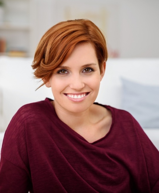 Smiling woman in red sweater