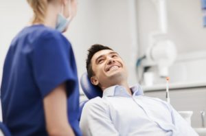 happy patient talking to dentist 