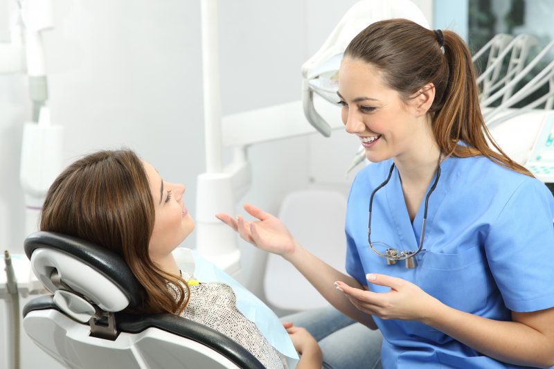 dentist speaking to patient about cosmetic dentistry