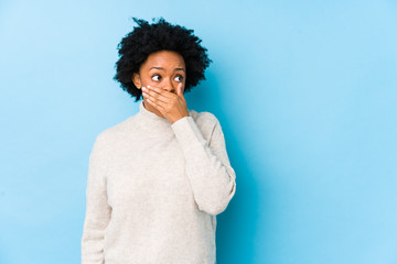 person covering mouth to hide cosmetic dental flaws