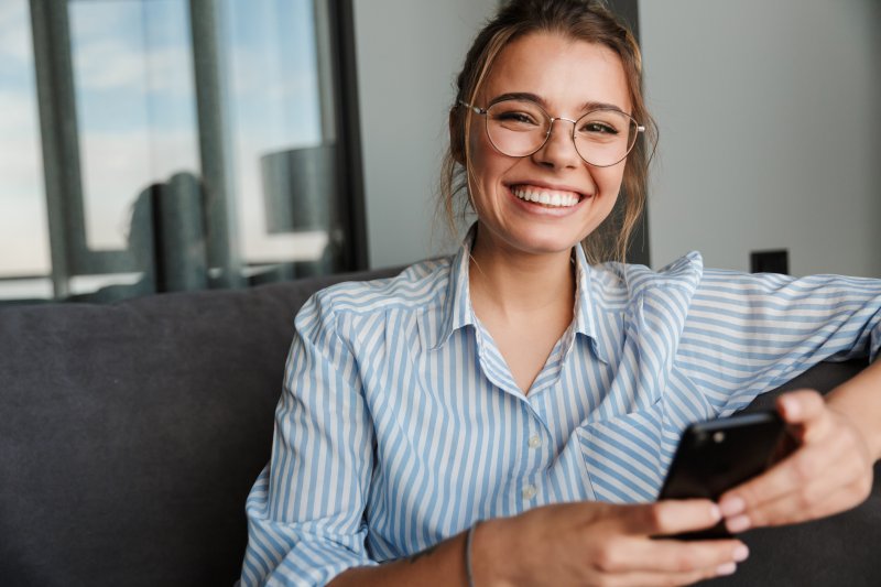 person with porcelain veneers smiling 