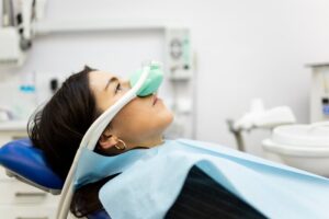 Woman getting laughing gas for her dental visit