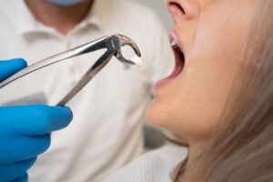 Woman having her tooth removed